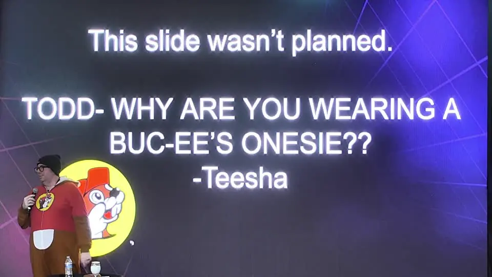 A giant slide reading: This slide wasn't planned. Todd — why are you wearing a Buc-ee's onesie?